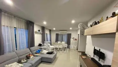 Spacious modern living room with stylish decor and ample natural light