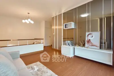Modern living room with stylish decor and wooden flooring