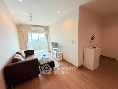 Spacious living room with modern decor and balcony view