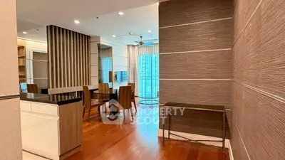 Spacious modern dining area with wooden flooring and stylish decor