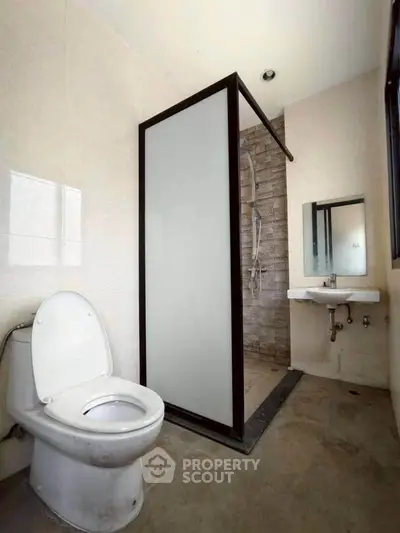 Modern bathroom with shower and toilet in minimalist design