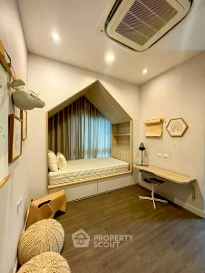 Charming children's bedroom with cozy built-in bed and modern decor