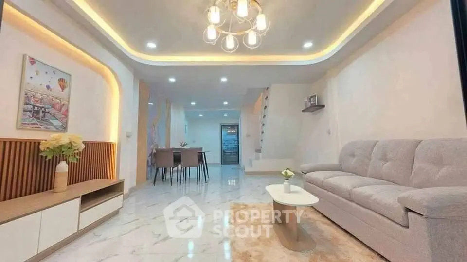 Spacious modern living room with elegant lighting and stylish decor