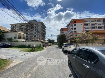 Scenic view of residential buildings on a sunny day with clear blue skies.