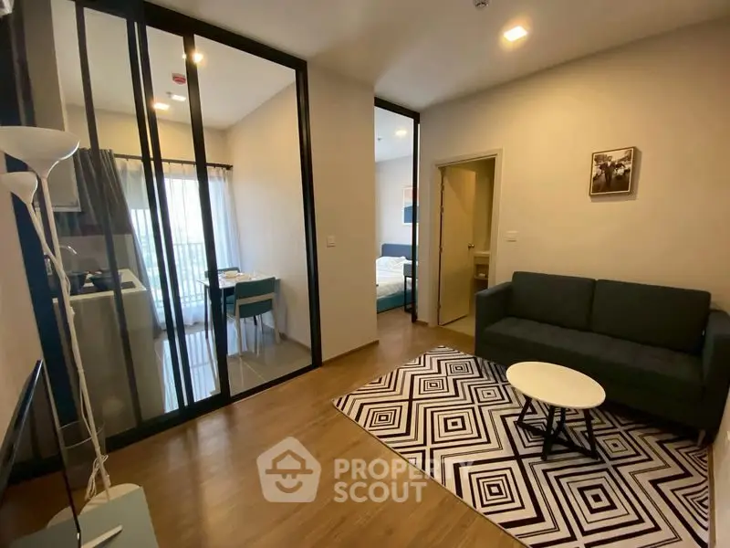 Modern living room with stylish decor and open layout in a contemporary apartment.