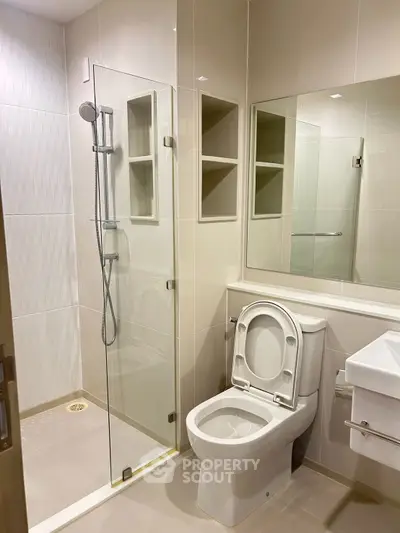 Modern bathroom with glass shower and sleek fixtures