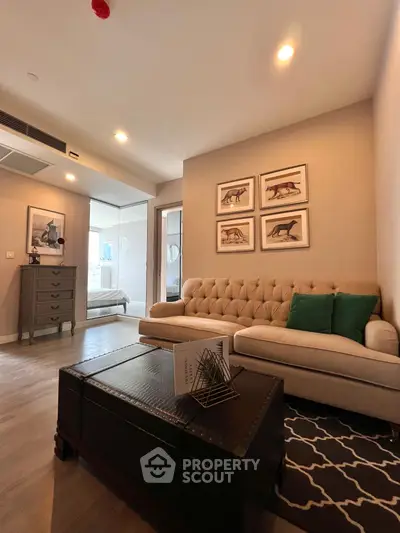 Stylish living room with elegant decor and cozy seating in modern apartment.
