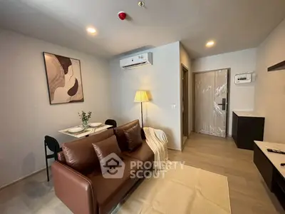 Modern living room with stylish decor and cozy seating in a contemporary apartment.