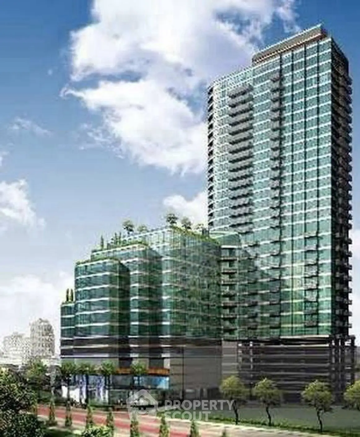 Modern high-rise building with glass facade and rooftop greenery in urban setting.