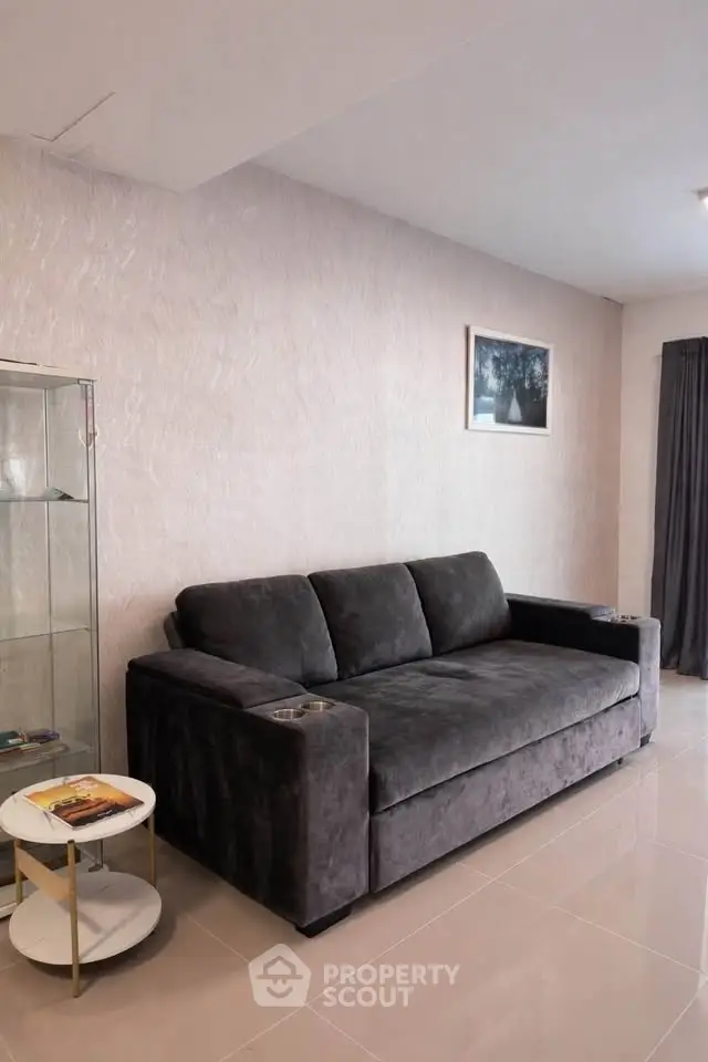 Modern living room with plush gray sofa and elegant decor