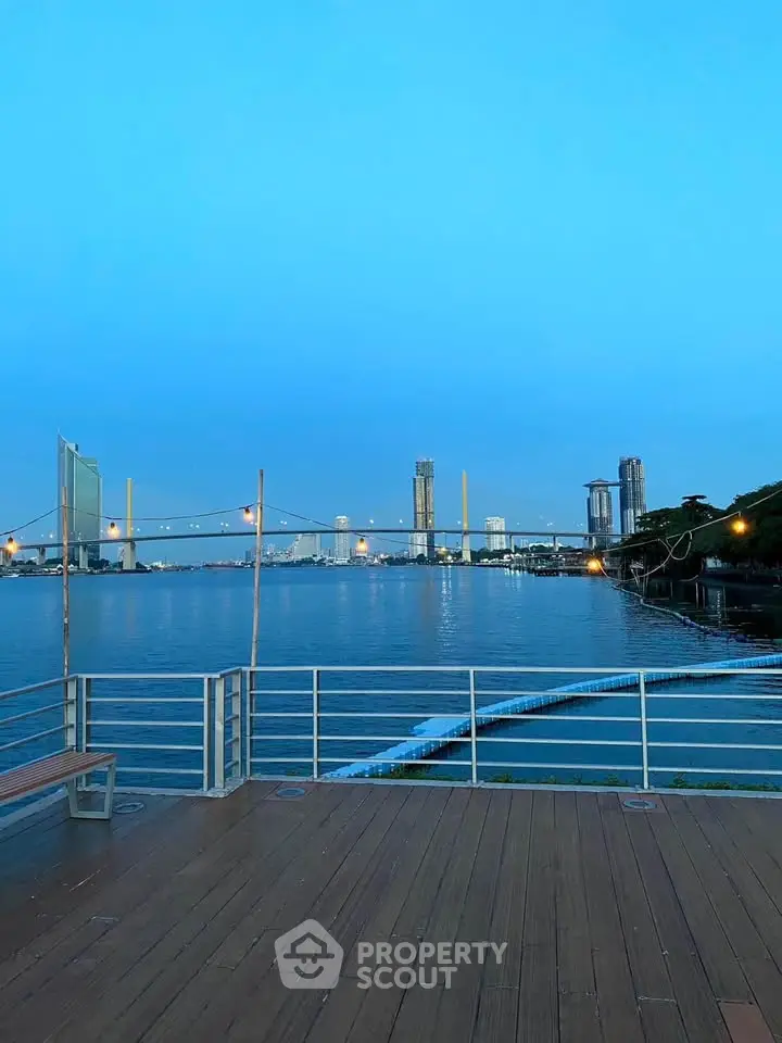 Stunning waterfront view with city skyline and bridge, perfect for serene living.