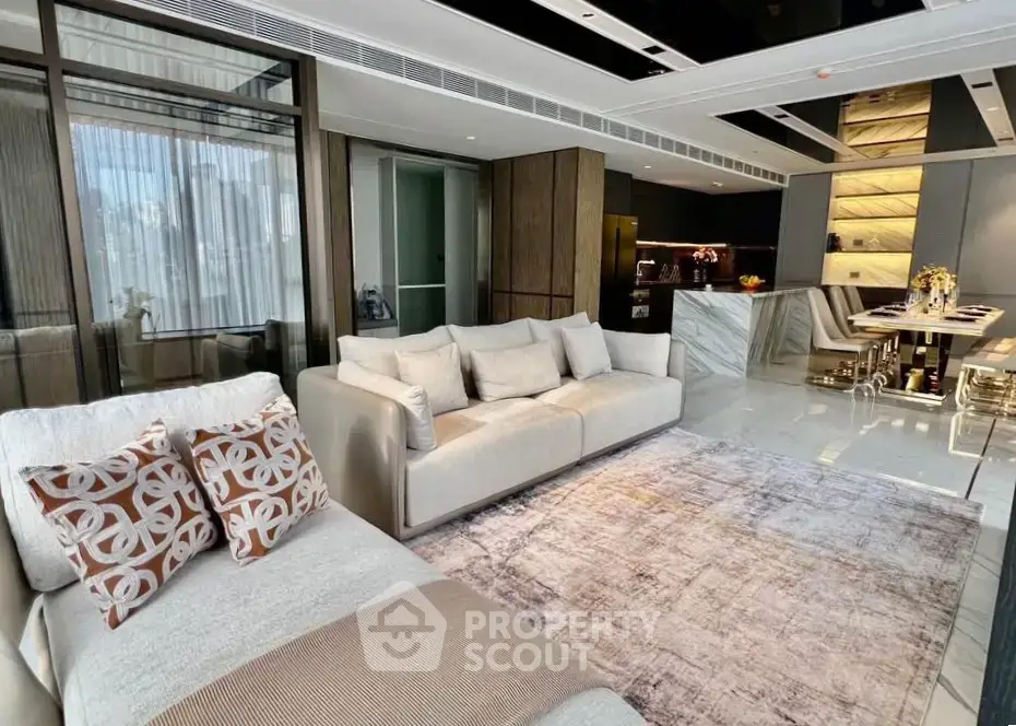 Luxurious modern living room with open kitchen and elegant decor