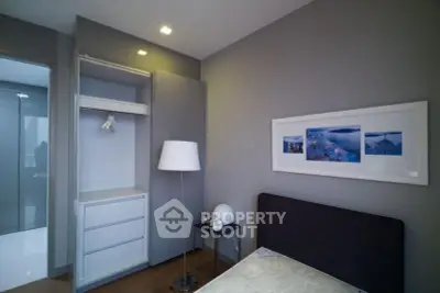 Modern bedroom with sleek design and built-in wardrobe