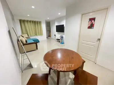 Spacious living room with modern decor and cozy seating area