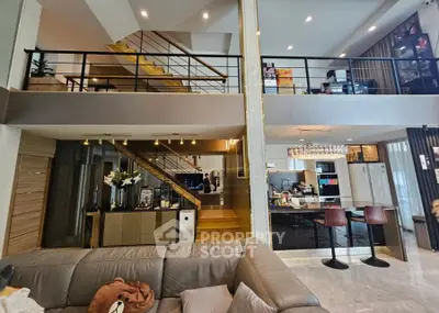 Luxurious open-plan living room with modern kitchen and stylish mezzanine.