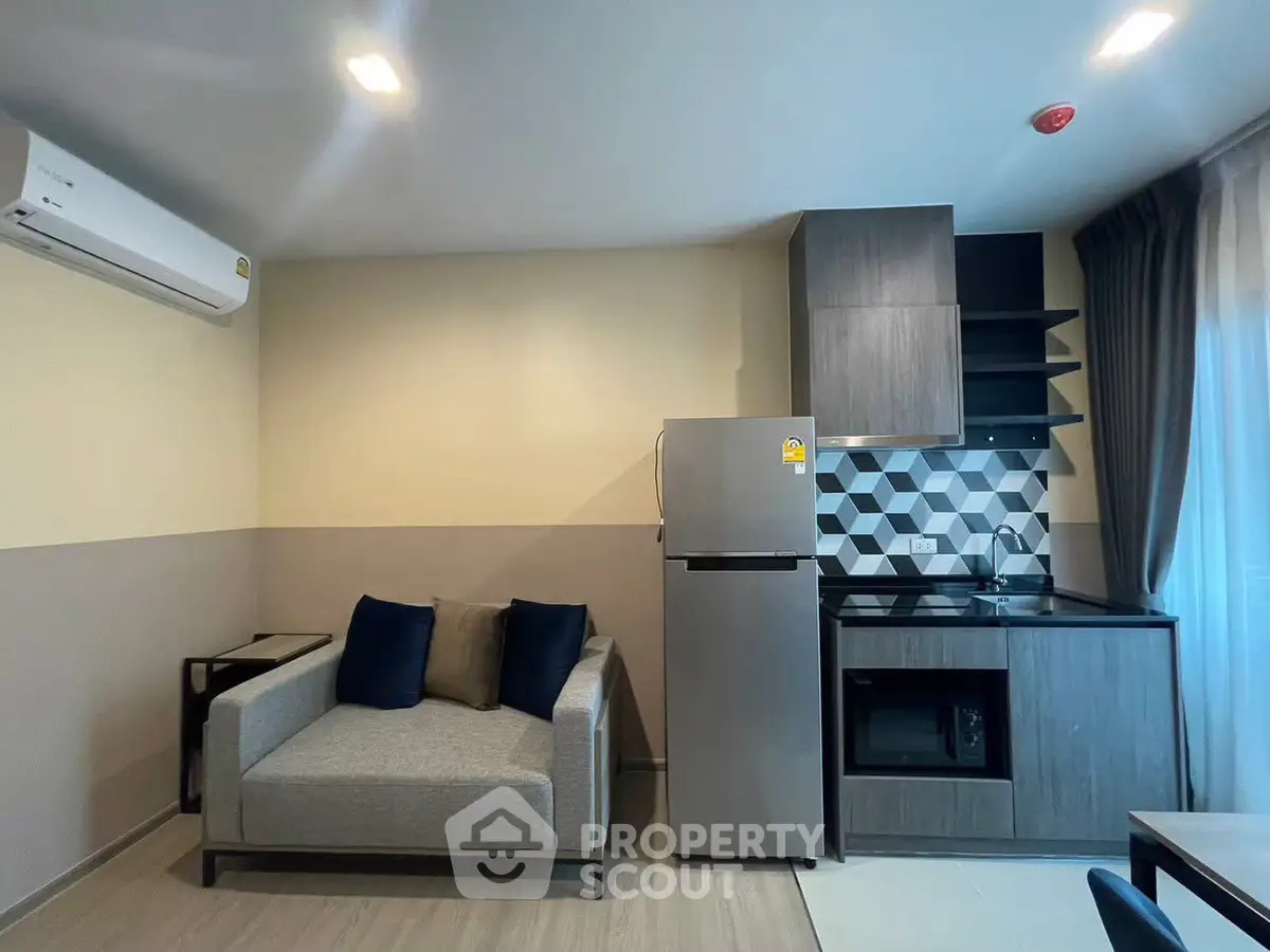 Modern compact living room with kitchenette and stylish decor