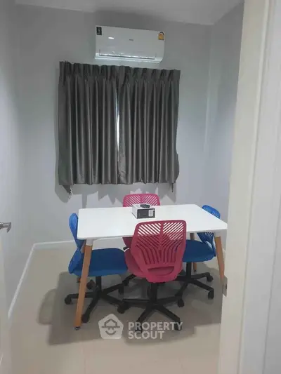 Modern study room with colorful chairs and air conditioning