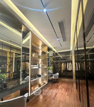 Luxurious walk-in closet with elegant lighting and modern design