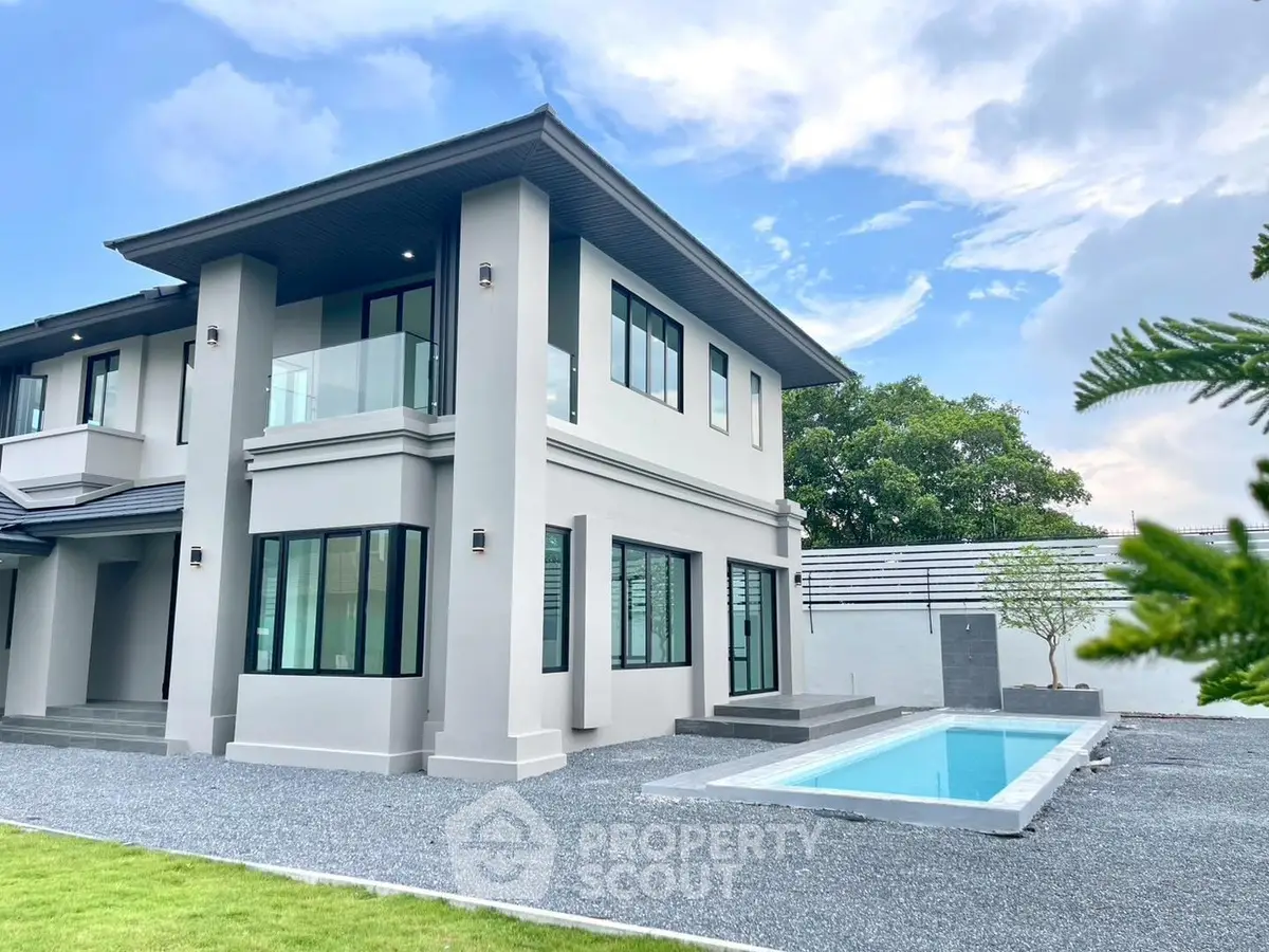 Modern two-story house with sleek design and private pool, perfect for luxury living.