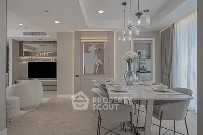 Elegant modern dining and living area with stylish decor and soft lighting.