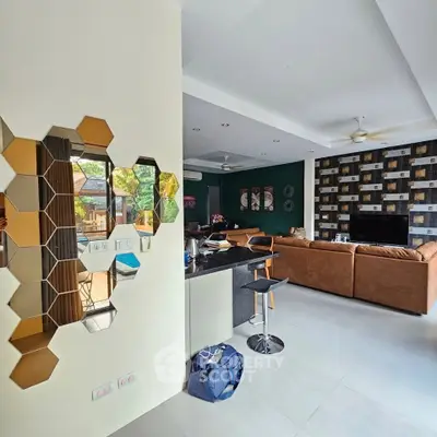 Spacious modern living room with stylish decor and open layout, featuring a cozy seating area and contemporary design.