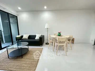 Modern living room with sleek furniture and natural light