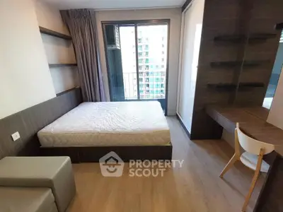 Modern bedroom with balcony view in urban apartment