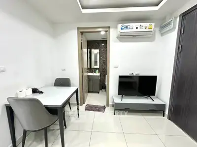 Modern compact living room with sleek furniture and air conditioning