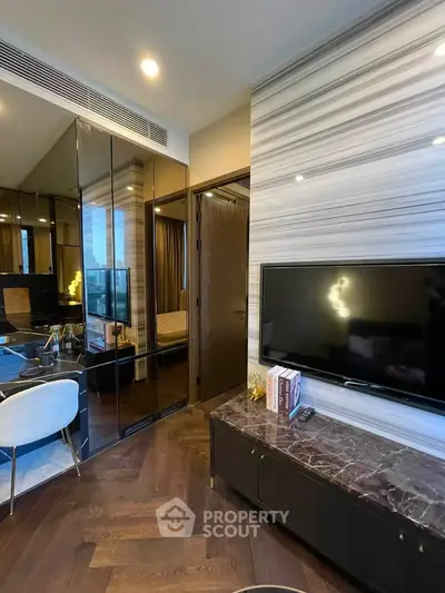 Luxurious modern living room with sleek TV setup and elegant decor