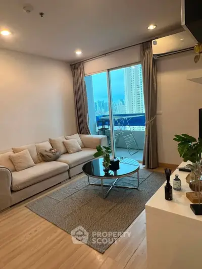 Modern living room with balcony view in high-rise apartment