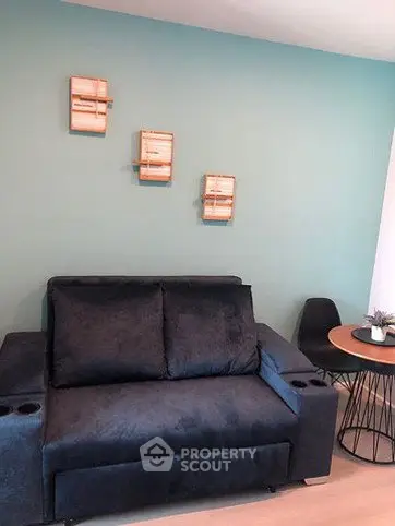 Modern living room with stylish sofa and accent wall