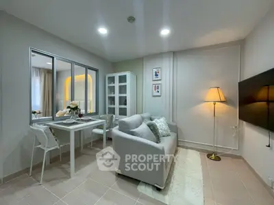 Modern living room with cozy sofa, dining area, and stylish decor in a bright, inviting space.