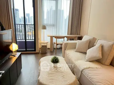 Modern living room with cozy sofa, stylish decor, and city view balcony in urban apartment.