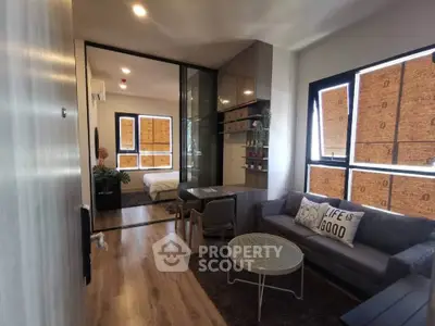 Modern studio apartment with cozy living area and stylish decor