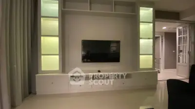 Modern living room with sleek TV unit and ambient lighting