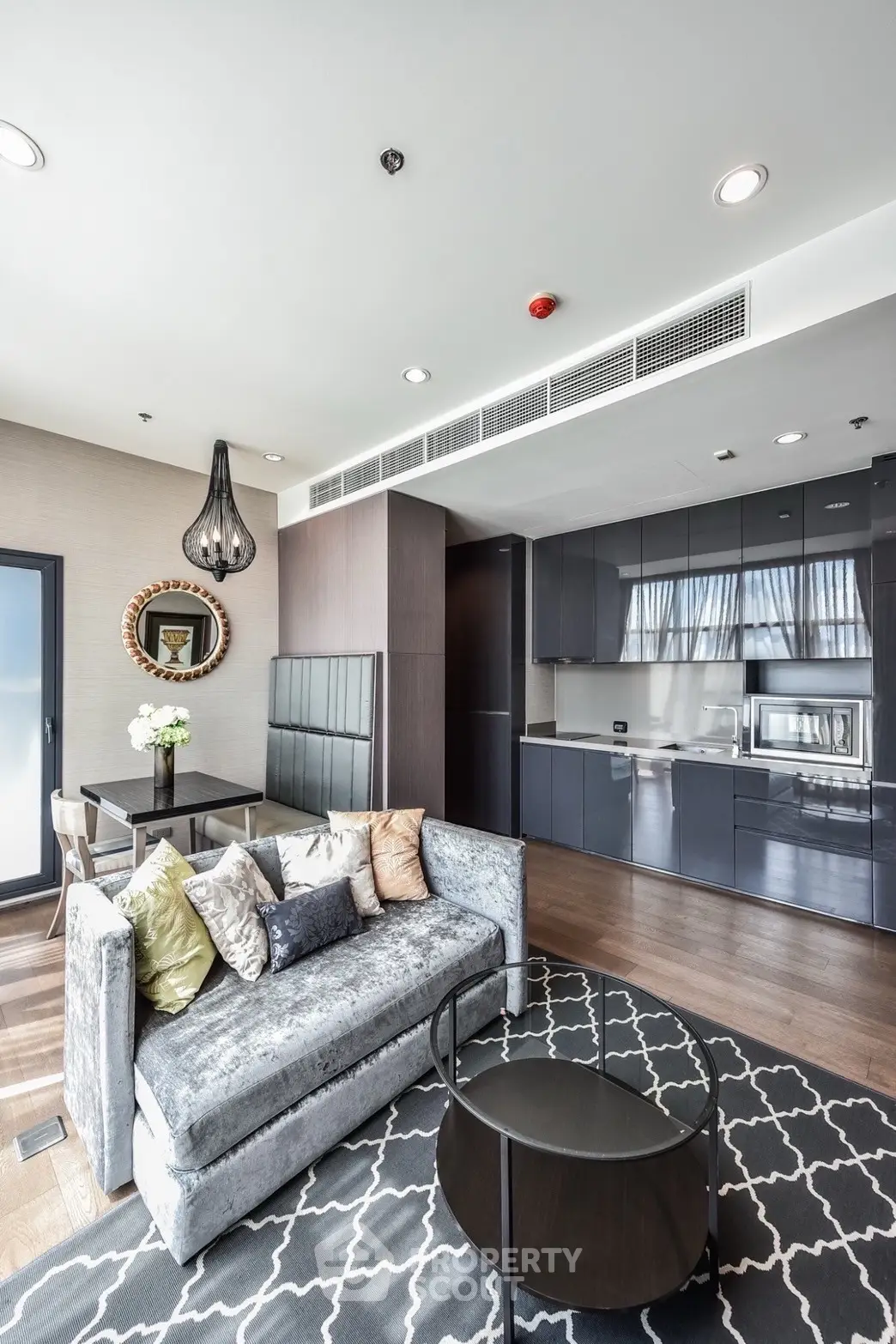 Modern living room with sleek kitchen and stylish decor in luxury apartment