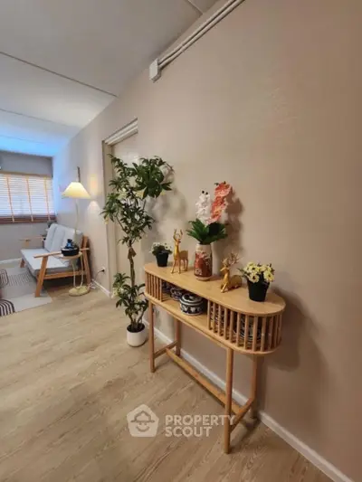 Charming hallway with elegant decor and wooden flooring in modern home.