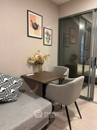 Modern living room with stylish decor and cozy seating area in a contemporary apartment.
