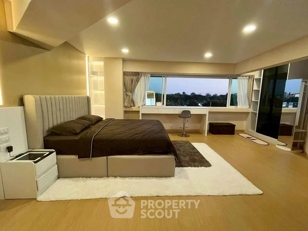 Luxurious bedroom with panoramic window and modern decor