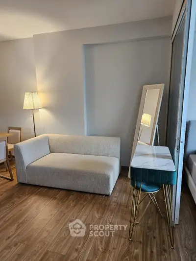 Modern living room with stylish sofa and elegant floor lamp