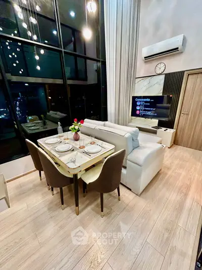 Luxurious modern living room with high ceilings and elegant dining area