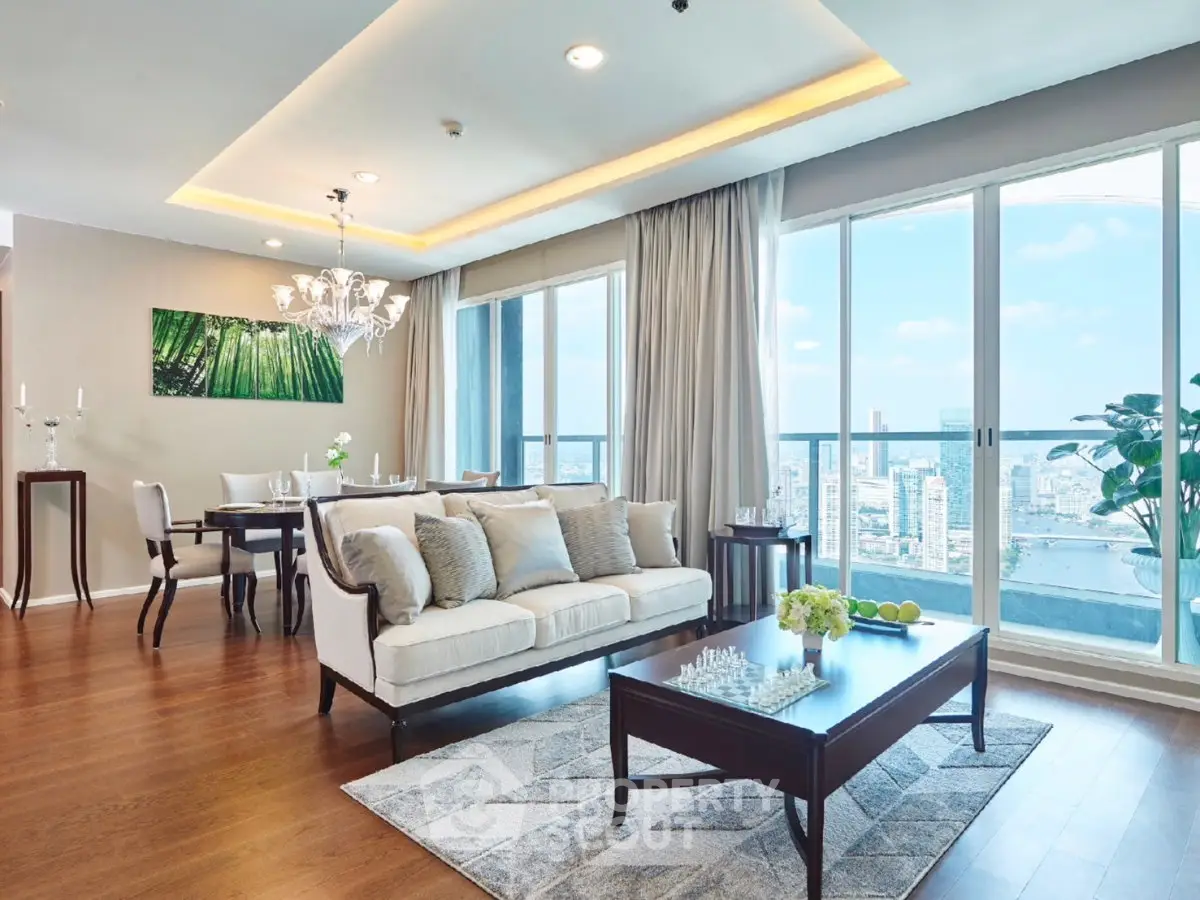 Luxurious living room with stunning city view, elegant decor, and spacious layout in a high-rise apartment.