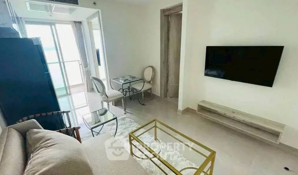 Modern living room with sleek furniture and wall-mounted TV