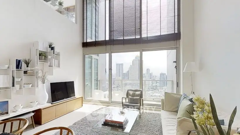 Modern living room with large windows and city view