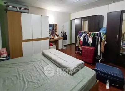 Spacious bedroom with ample storage and cozy decor