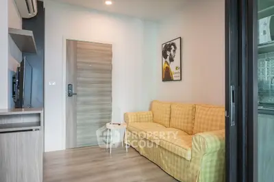 Cozy living room with yellow checkered sofa and modern decor in a stylish apartment.