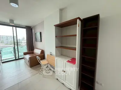 Modern living room with balcony and stylish furniture in urban apartment