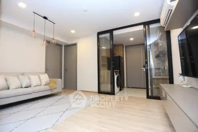 Modern living room with open kitchen and stylish lighting