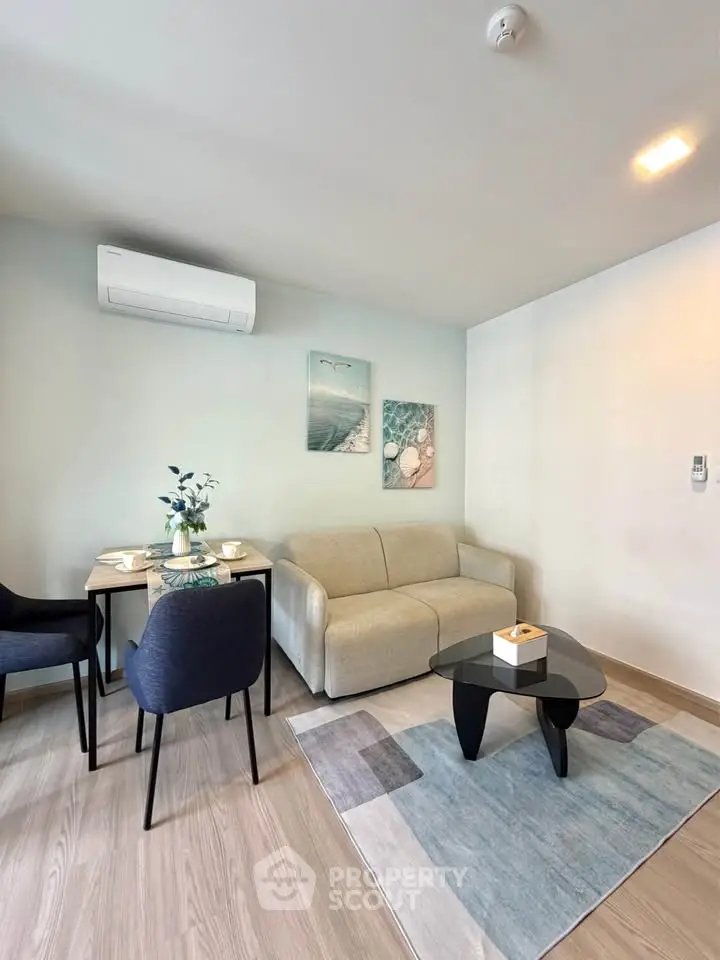 Modern living room with stylish furniture and air conditioning, perfect for cozy urban living.