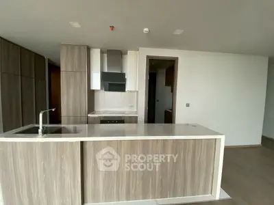 Modern kitchen with sleek wooden cabinetry and open layout design